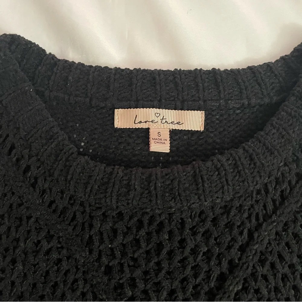Black crew neck dropped shoulders ribbed trims knit sweater